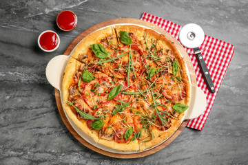 Flat lay composition with tasty homemade pizza on table