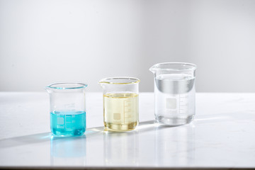 doctor woman scientist making herbal medicine in lab with herb leaves vitamin supplements mineral alternative treatment research.