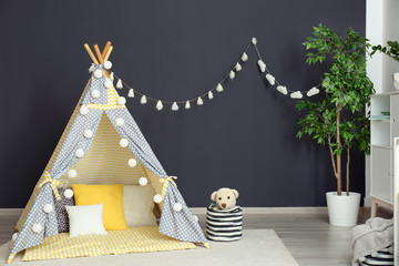 Cozy kids room interior with play tent and toys © New Africa