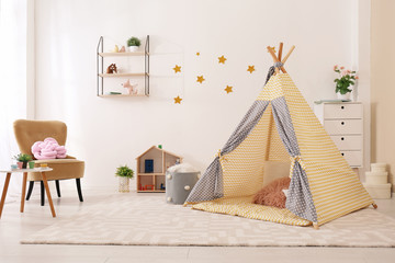 Cozy kids room interior with play tent and toys © New Africa