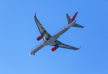 plane with landing gear against the blue sky