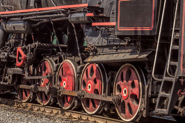 Fototapeta na wymiar Wheels of old steam locomotive.