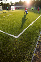 Naklejka premium Soccer training on a lovely fotball pitch