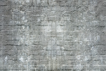 Old dirty grey brick wall for texture or background.