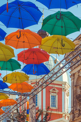 Fototapeta na wymiar Installation of floating umbrellas in Solyanoy lane, St. Petersburg