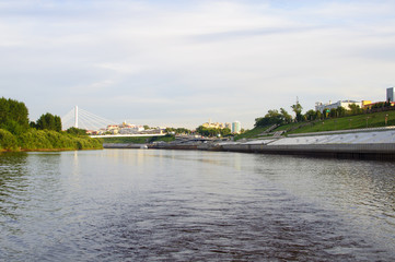 Fototapeta premium The suspension bridge and Tura River Embankment in Tyumen, Russia.