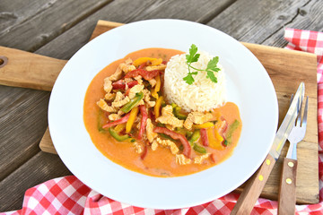 Turkey sliced with 3 colorful of paprika and sour cream Serve with rice..Paprika menu for healthy.