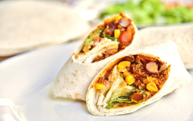 Chili Con Carne Burrito with fresh vegetable.