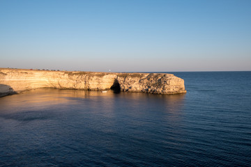 The Crimean Peninsula-Cape Tarkhankut summer is pure Black sea, rocky shore, evening light