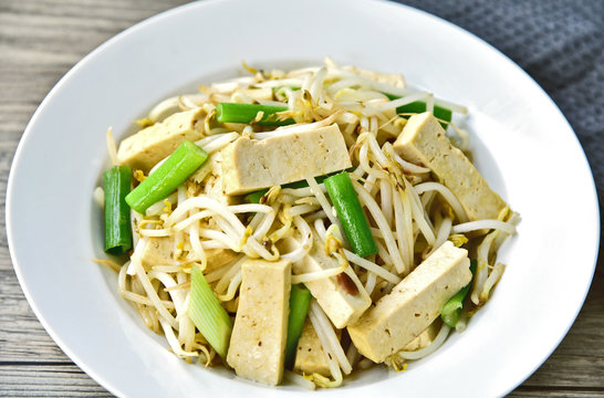Stir Fried Bean Sprouts with tofu and scallion. Asian vegetable stir fry