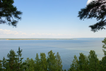 View of the river with the opposite bank through the trees