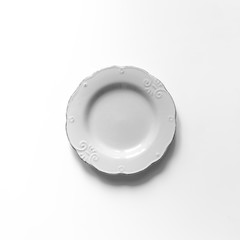 Top view of vintage white plate. Flat lay