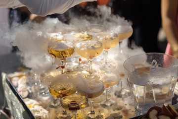 Champagne glasses on gold background. Party and holiday celebration concept