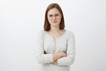 Woman thinking guy lying staring suspicious with disbelief. Intense unsure smart european young...