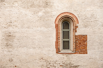 The window and the texture of the plastered wall