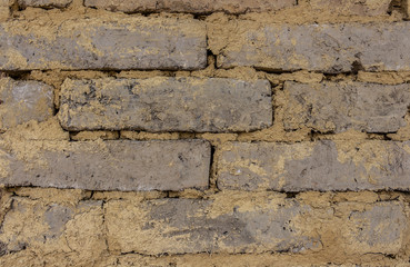The walls are created from natural clay. Clay into a square to build a wall or a house.