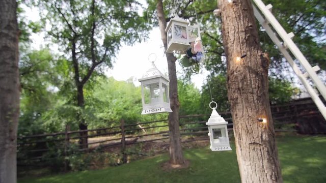 HD CLoseup shot of lattern which decorate the tree on the wedding yard