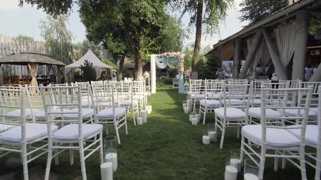 HD Shooting of the decorated yard for wedding ceremony all in white