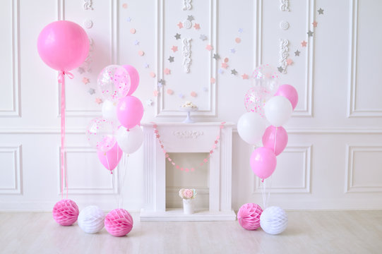 Children birthday. Decorations for holiday party. A lot of balloons pink and white colors. 