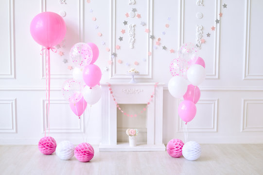 Children birthday. Decorations for holiday party. A lot of balloons pink and white colors. 