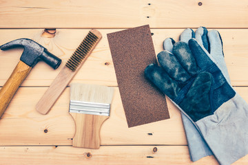 many tools for construction on wooden plank