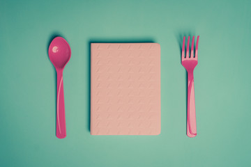 pink diary for keeping notes of food and health plans