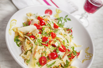 Pasta al pomodoro with prosciutto, tomato, rocket and parmesan