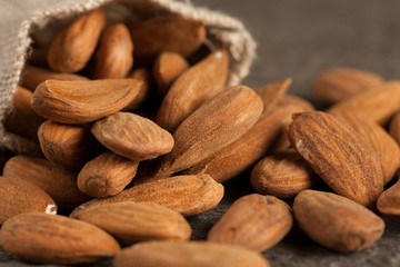 Almonds on wooden background