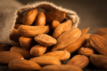 Almonds on wooden background