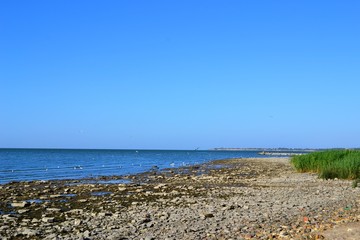 beach, sea, sky, water, coast, ocean, sand, landscape, blue, nature, summer, travel, shore, horizon, coastline, wave, vacation, rock, panorama, island, clouds, holiday, view, bay, seascape