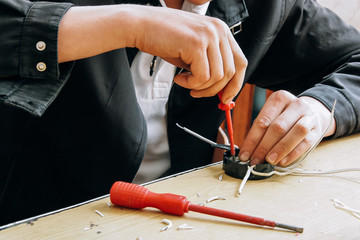 Hands of electrician