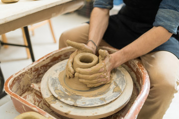 Artist's Hands Making Creative Art Product With Clay