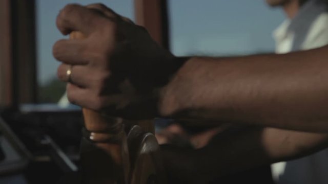 Captain on bridge at the helm