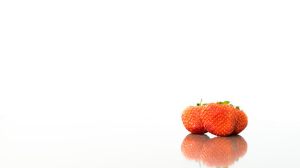 Strawberry reflection with a white background