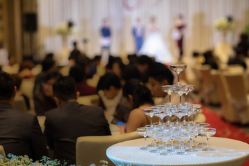 Champagne glass pyramid.pyramid of glasses of wine, champagne, tower of champagne's glass in wedding reception party