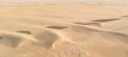 Fototapeta na wymiar road over taken by sand dunes