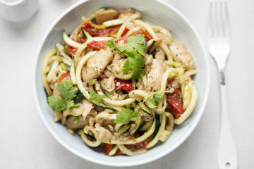 Vegetarian stir fry with chilli & coriander soya chunks with spiralled courgette spaghetti and semi dried tomatoes 