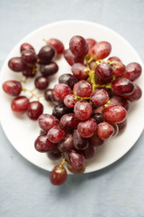 Red grapes on plate 