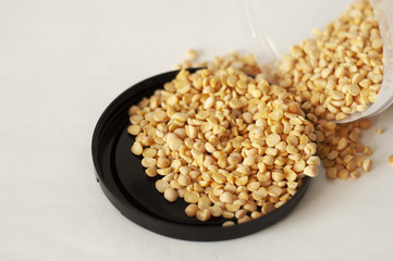 isolated photo of dry yellow peas. white background