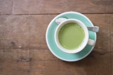 top view hot matcha green tea on wooden table