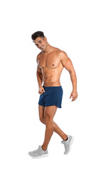 Handsome young runner posing on white background
