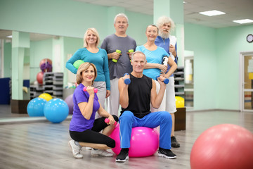 Group of elderly people in modern gym