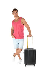 Young man with suitcase on white background