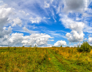 Fototapeta na wymiar Landscape with clouds in the summer sky. The last days of August.