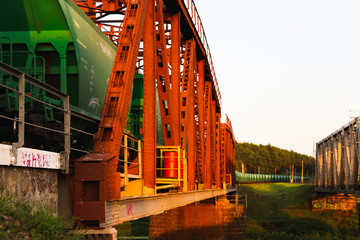 Sunset on the railway bridge. Evening