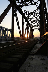Sunset on the railway bridge. Evening