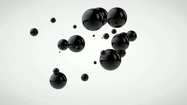 3D animation of metal balls that fall to the surface.