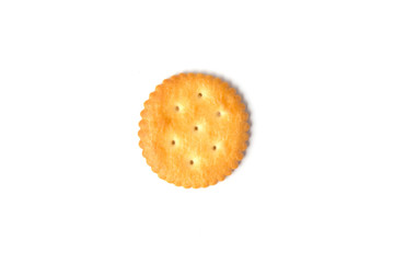 Top view of round salted cracker cookie isolated on white background.