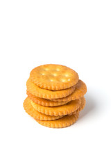 Round salted cracker cookies stacked isolated on white background.