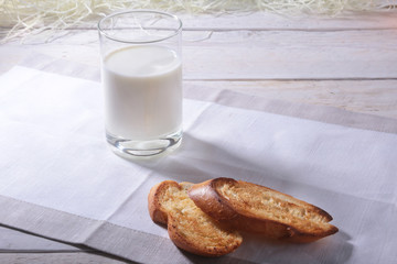 Morning Breakfast set with orange jam on bread toast and milk in glass.